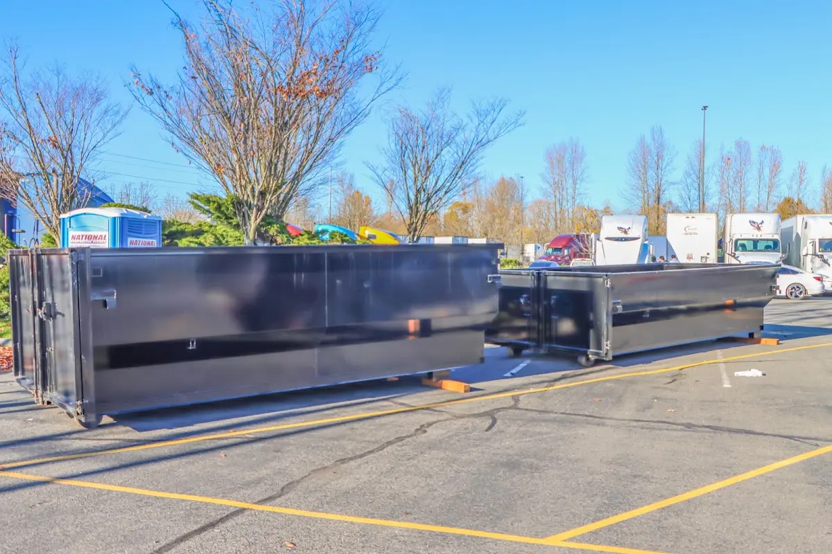 Professional dumpster rental service with roll-off container on residential driveway in Issaquah